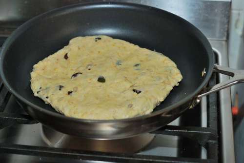Flat breads like bannock look like pancakes and are baked in a pan.